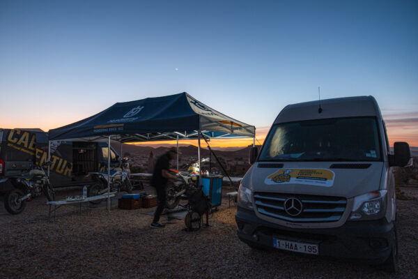 Support van and camp at sunset in Morocco