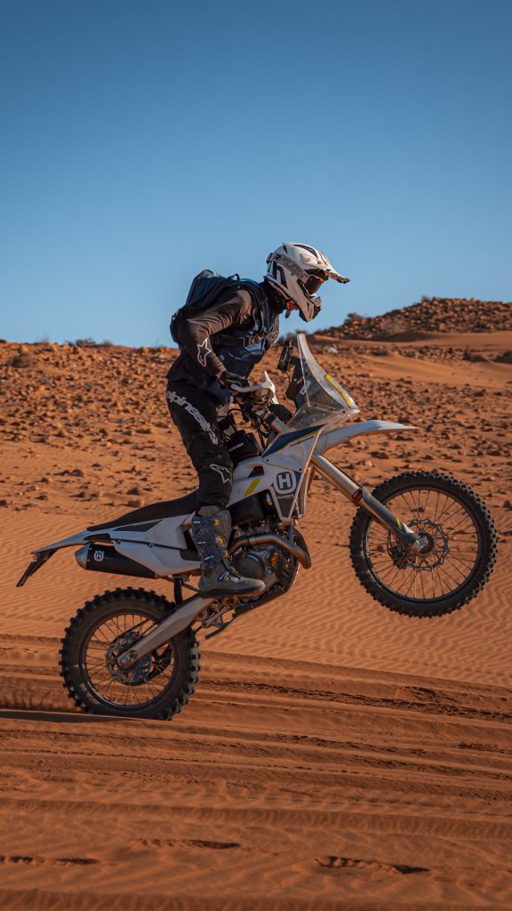 Enduro rider jumping in the Moroccan sand