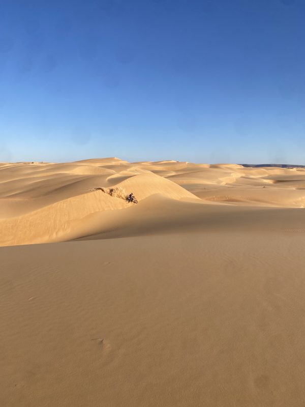 Rider on the edge of a big dune in Mauritania